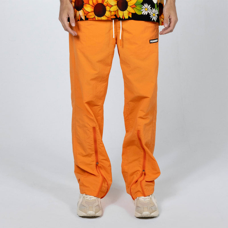 ASOS DESIGN baggy nylon track pants in brown with orange side stripe | ASOS